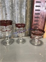 Red-trimmed goblets (two sizes), dessert dishes