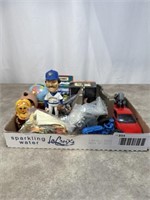Small toy figurines and frogs, toy cars, tractors