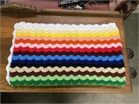 Multi Colored Crochet Blanket Has Small Stain