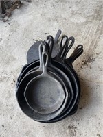Nine Cast Iron pans and a flat iron