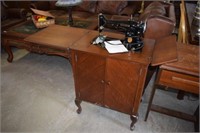 Antique Singer Sewing Machine in Oak Cabinet