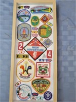 Framed assorted scout badges
