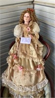 Porcelain doll measuring approximately 45 inches