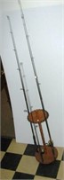 Wood fishing pole stand that holds 24 fishing
