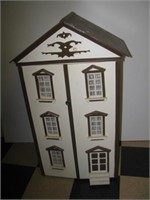 Wood doll house. Measures 40" h x 23.5" w x 14"
