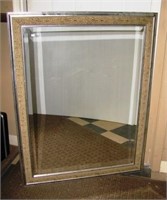 Large decorative framed wall mirror. Measures 36"