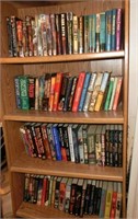 4 shelves of paperbacks bookcase in bad condition