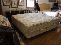 King-size bed with brass headboard, spring