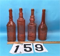 4 Auburn colored bottles