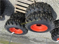 E(4) new 12-16.5 skid steer tires on Bobcat wheels