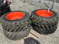 E(4) new 10-16.5 skid steer tires on Bobcat wheels