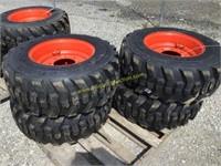 E. 4 new 12-16.5 skid steer tires on Bobcat wheels
