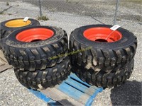 E(4) new 12-16.5 skid steer tires on Bobcat wheels