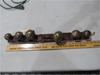 Five Large Brass Sleigh Bells on Leather Strap