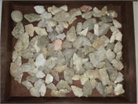 Display case of arrowheads and rocks