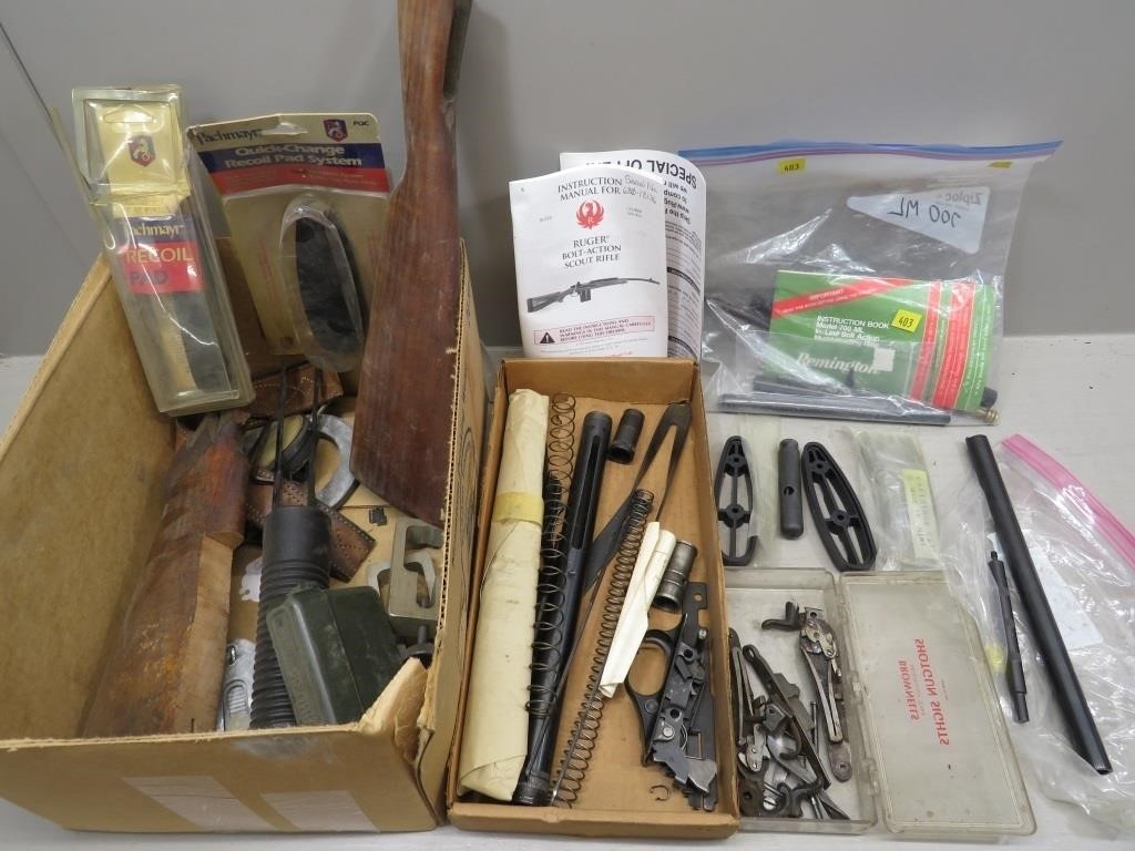 Assorted gun parts, butt stocks, instruction