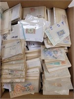 Worldwide Stamps on and off paper in bankers box,