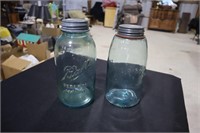Two 2 quart blue canning jars with zinc lids one