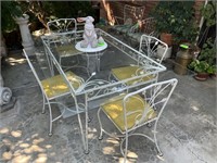Wrought iron table with four chairs