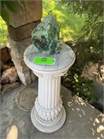 Pedestal with decorative rock