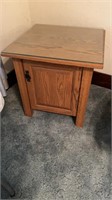 Wooden end table with glass top