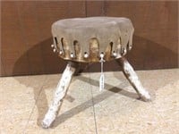 Hand carved leather upholstered work stool