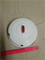 Vintage enamel lid with red trim and handle