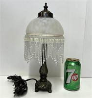 Lampe vintage en fonte, laiton et verre