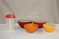 Tupperware, four graduating bowls with three