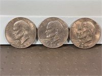 Three 1978 Ike dollars