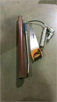 Metal post driver, water wand, saw and grease gun