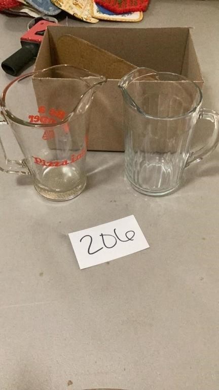 Two glass pictures, including one that says pizza