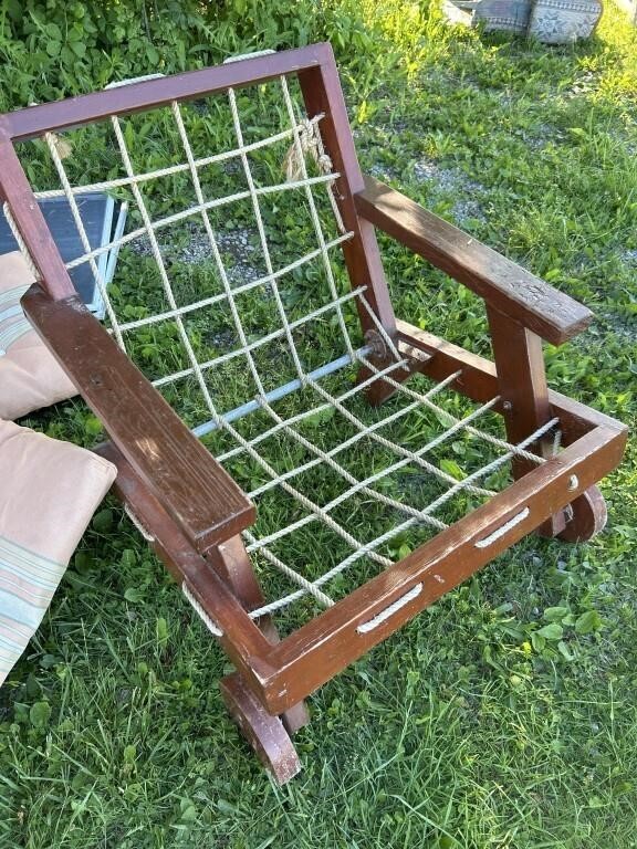 Vintage Rope Strung patio Chair with wood wheels