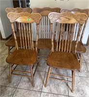 Five wood dining chairs
