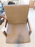 upholstered wood framed office chair on casters