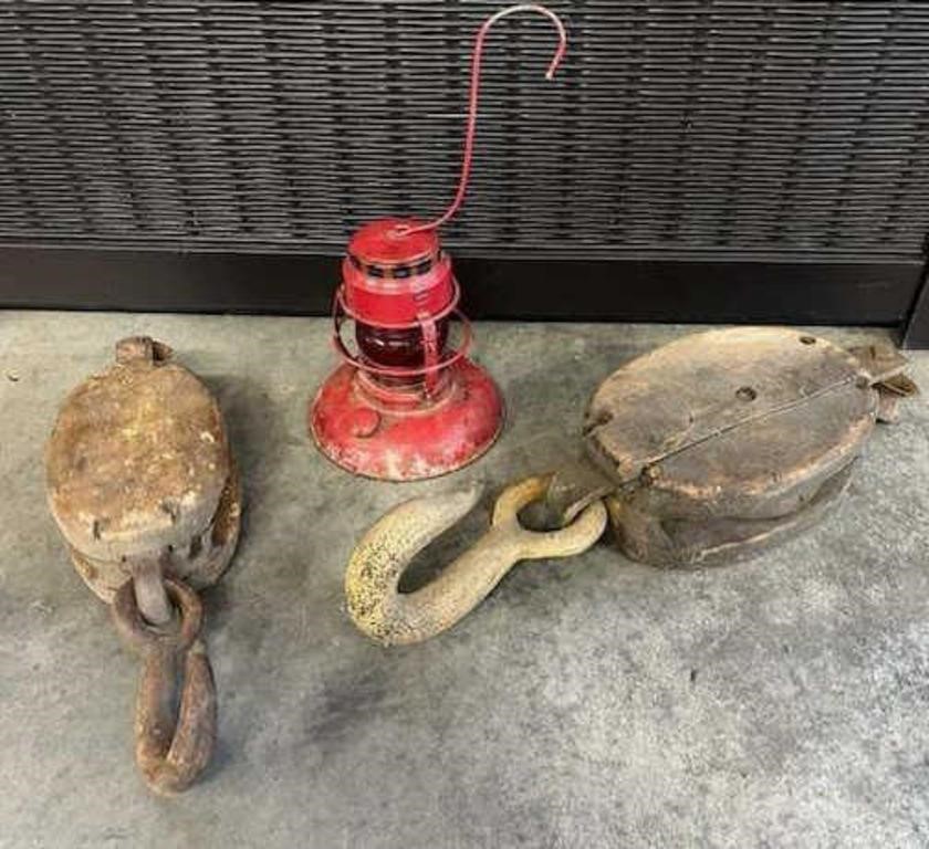 Two large wood, pulleys and vintage kerosene lamp