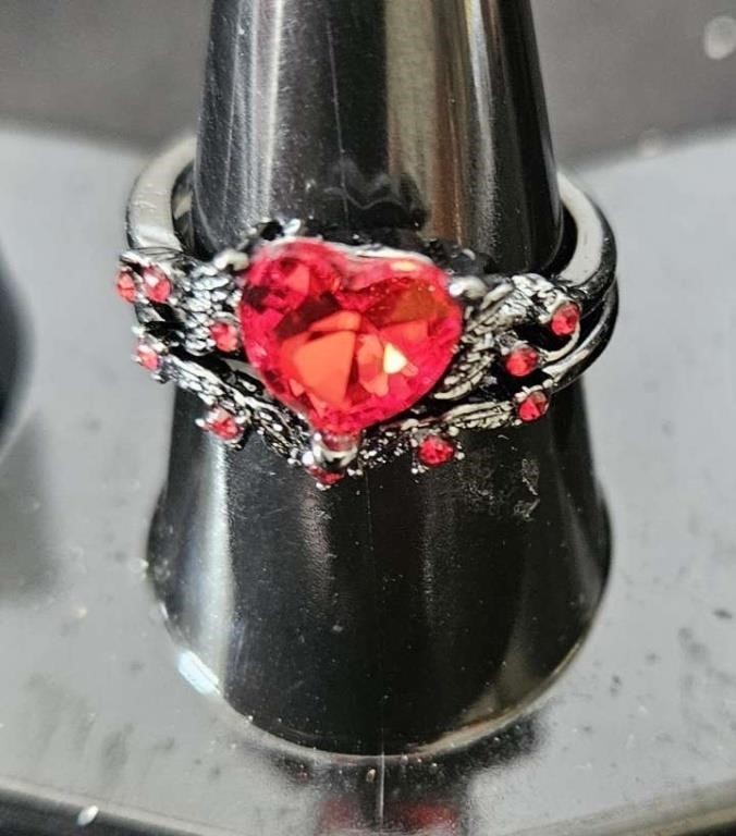 2 rings with red stones