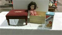 Small footstool, vintage doll and cracker can