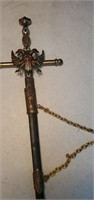 A long thin sword with eagles and a crest