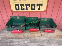 three Coleman two burner gas stoves