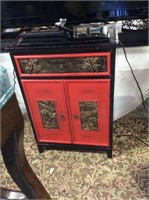 Red and black Asian side cupboard