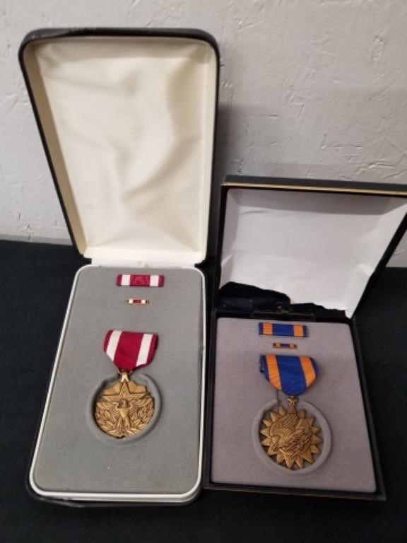 Two metals one for meritorious service and one