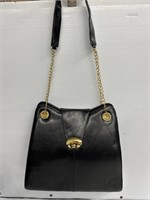 Black purse with gold trimmings