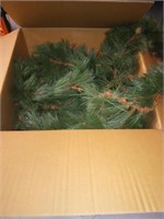 Box full of evergreen Garland