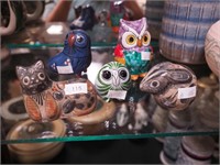 Five stylized pottery animals including owls,