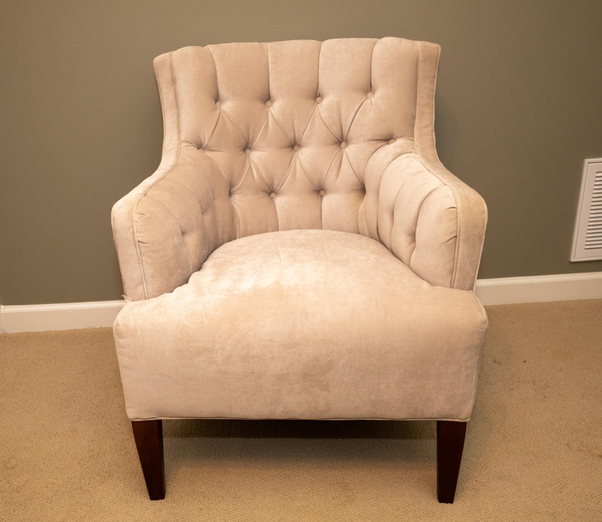 Contemporary tufted club chair.