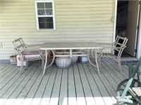 Outdoor table and chairs with cushions