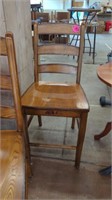 4 WOOD CHAIRS ( SEAT IS 24 AND A HALF INCHES