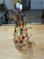 Ornate multi-colored decorative pitcher