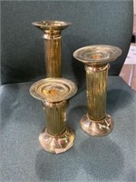 Three golden candle holders measurement 10in down